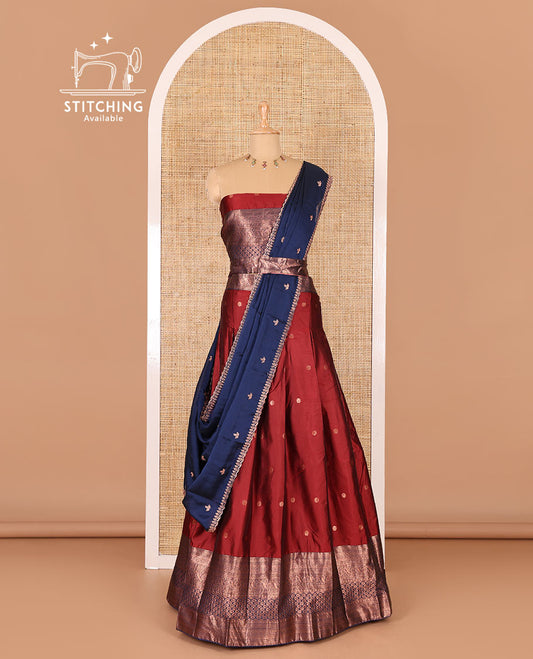 Maroon taffeta silk half-saree, flower zari buttas and contrast traditional zari bordered skirt, a matching blouse, and contrast embroidered satin georgette scallop dhavani