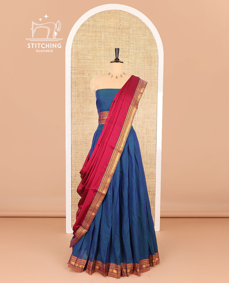Blue half saree, plain with contrast traditional zari bordered skirt, matching blouse and a contrast peacock border dhavani