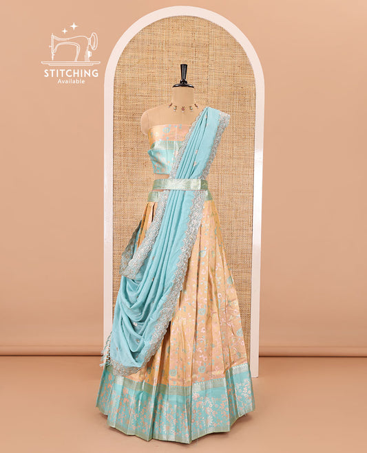 Peach banarasi half-saree, floral jaal thread weave with contrast floral thread bordered skirt, a matching blouse, and scallop embroidered dhavani with belt