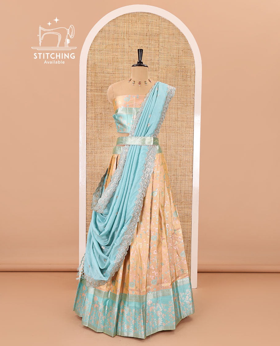 Peach banarasi half-saree, floral jaal thread weave with contrast floral thread bordered skirt, a matching blouse, and scallop embroidered dhavani with belt