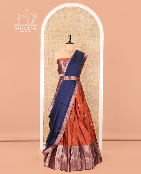Rust and Blue Semi-Banarasi Half-Saree, Detailed with Zari Buttas on Its Skirt, Complemented by a Contrast Traditional Zari-Design Border, Paired with a Matching Blouse, and a Contrast Satin Georgette Zari-Bordered Dhavani