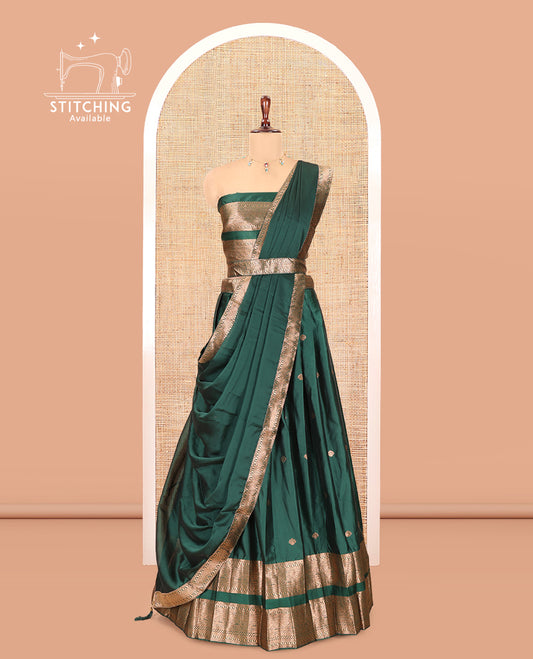 Green Semi-Silk Half-Saree, Adorned with Zari Buttas Woven Skirt, a Rettai Pettu Traditional Border, a Matching Blouse, and Dhavani