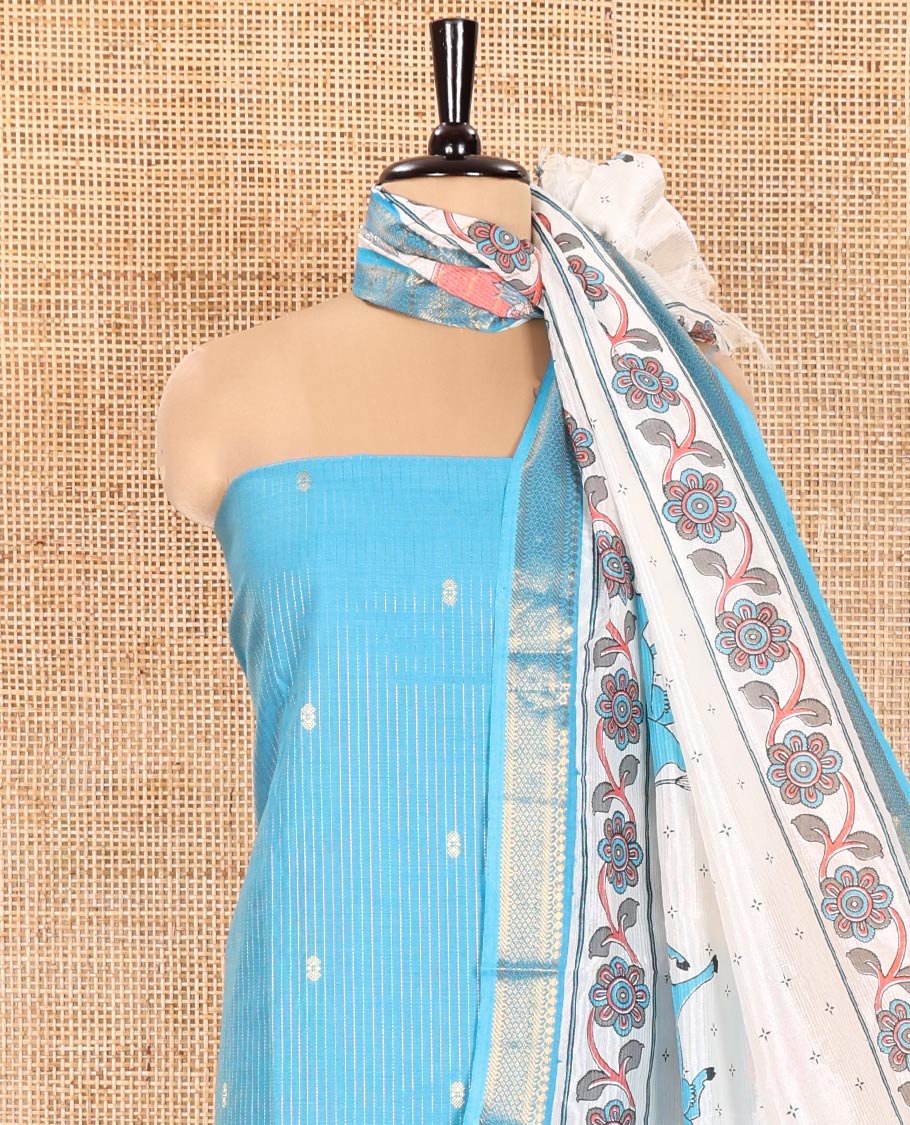 Blue Material Chudidhar Set, Delicately Woven with Dotted Stripes and Buttas on Its Semi-Silk Top, Plain Cotton Bottom, and Semi-Silk Dupatta Illustrating Pichwai Cow and Floral Print