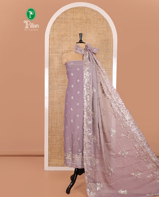 Lavender Material Churidar Set, Artfully Detailed with an Floral Motifs Embroidered on Its Nc Moss Organza Top, Plain Santoon Bottom, and Nc Moss Organza Scallop Dupatta of Floral-Leaf Embroidery