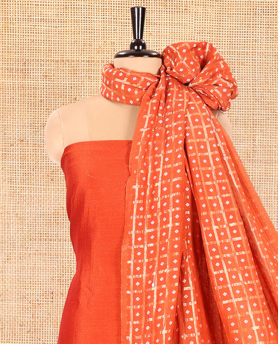 Orange Vichitra Silk Material Churidar Set, Subtly Made Plain Top, a Plain Santoon Bottom, and Paired with a Vichitra Silk Bandhani Dot Enclosed Checked Dupatta