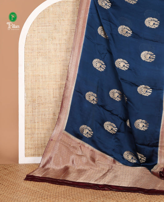 Dark blue animal print mushru silk saree with bawanchi border & rich pallu along with butta design blouse