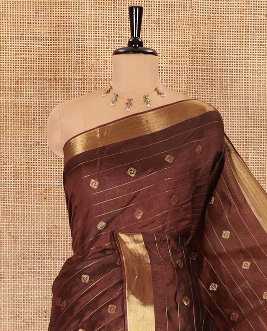 Brown zari buttas and striped banana pith saree, bavanji border, zari striped pallu, and a matching blouse