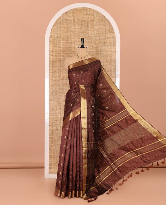 Brown zari buttas and striped banana pith saree, bavanji border, zari striped pallu, and a matching blouse
