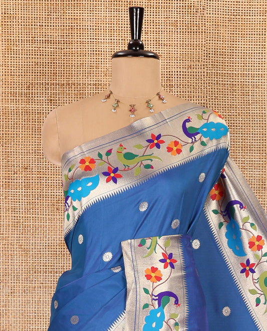 Blue floral buttas art silk paithani saree, contrast floral creeper and peacock design border, pallu of peacock and floral vine, and a matching blouse