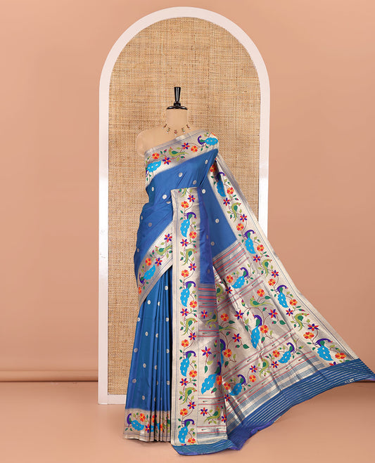 Blue floral buttas art silk paithani saree, contrast floral creeper and peacock design border, pallu of peacock and floral vine, and a matching blouse
