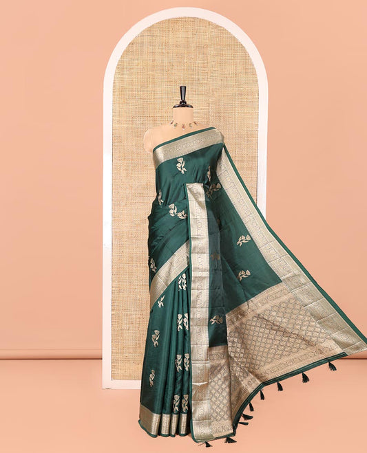 Bottle Green Semi-Banaras Satin Silk Saree, Beautified with Floral Zari Buttas Across Its Body, Highlighted by Traditional Zari Design Border, Grand Zari Woven Palu of Jaal Designs, and Paired with a Matching Blouse