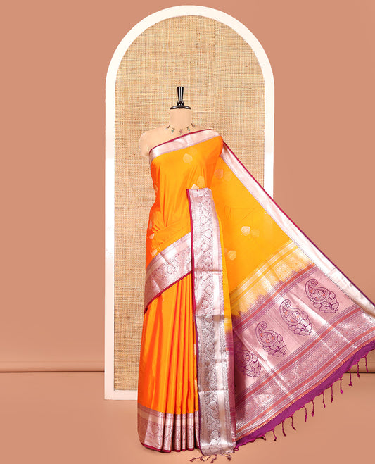 Fanta Orange Semi-Soft Silk Saree, Gleamed Up with Zari Buttas All Over Its Body, Complemented by a Contrast Traditional Zari Design Border, Intricately Designed Pallu, and Paired with a Contrast Blouse
