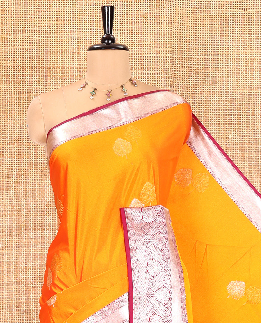 Fanta Orange Semi-Soft Silk Saree, Gleamed Up with Zari Buttas All Over Its Body, Complemented by a Contrast Traditional Zari Design Border, Intricately Designed Pallu, and Paired with a Contrast Blouse