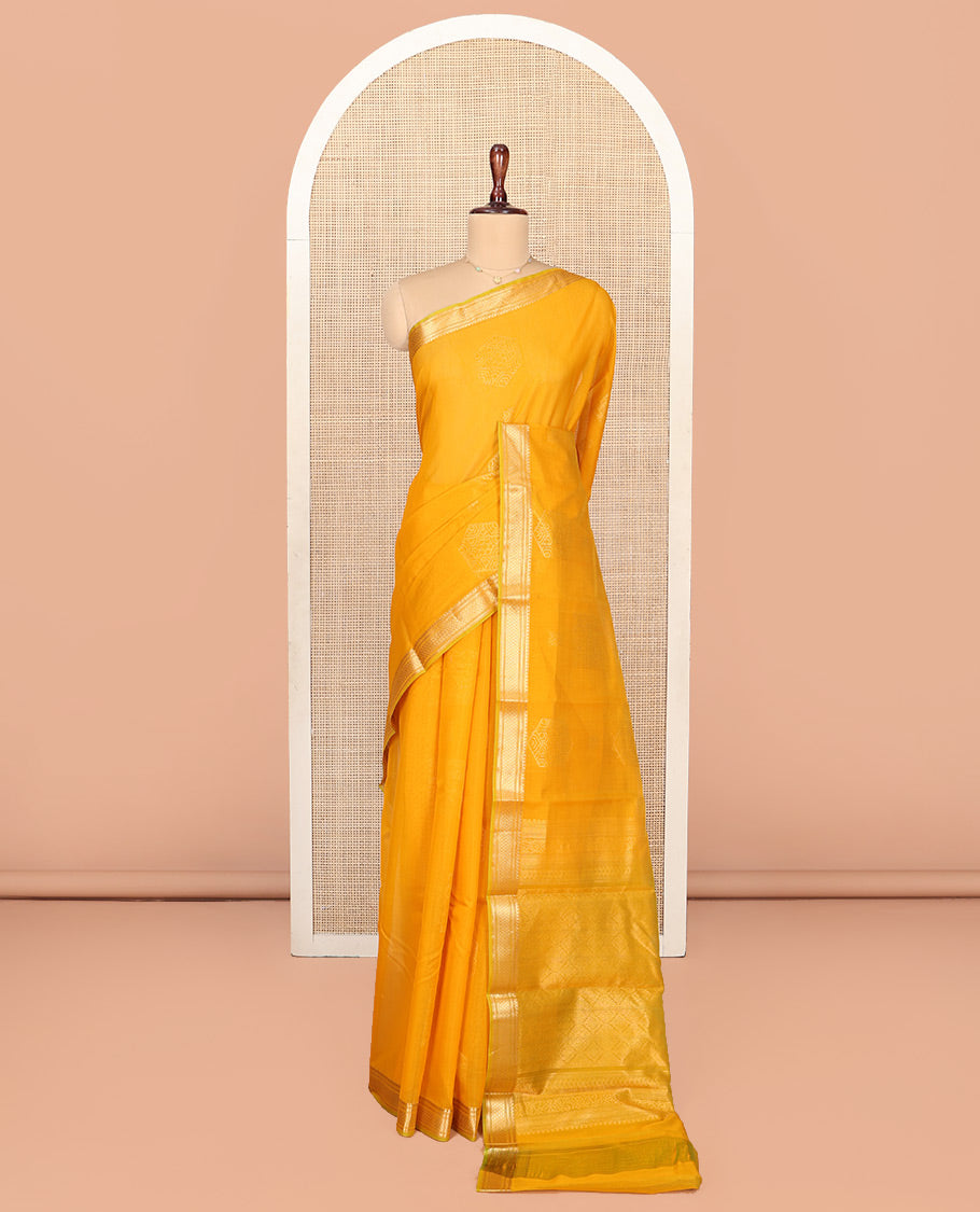 Yellow Silk Cotton Saree, Sparsely Woven with Geometric Buttas All Over Its Body, Highlighted by Traditional Zari Designs Woven Border, Grand Jaal Pallu and Paired with a Matching Blouse