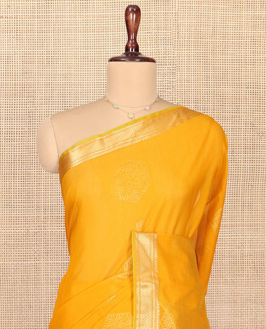 Yellow Silk Cotton Saree, Sparsely Woven with Geometric Buttas All Over Its Body, Highlighted by Traditional Zari Designs Woven Border, Grand Jaal Pallu and Paired with a Matching Blouse