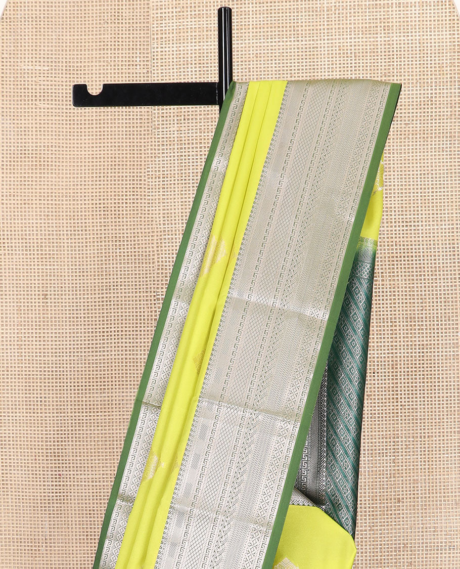 Yellow zari buttas soft silk saree, contrast traditional zari design border, and intricate pallu