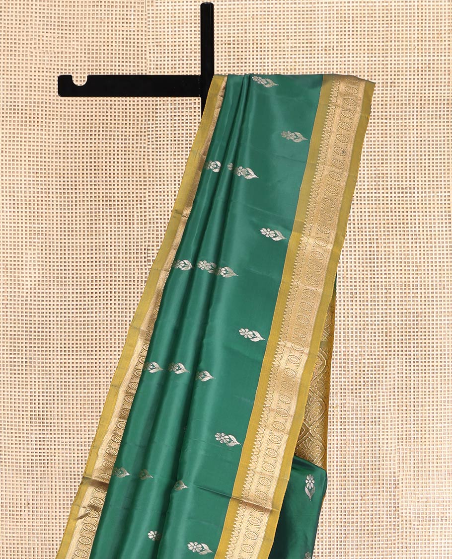 Green Uppada Silk Saree, Highlighted with Zari Buttas, a Contrast Traditional Zari Border, Contrast Intricate Pallu, and a Contrast Blouse