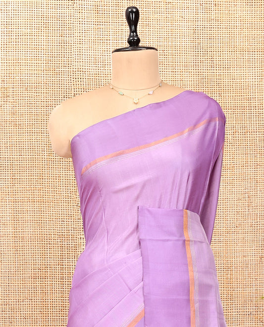 Lavender Plain Uppada Silk Saree, Complemented by a Plain Border, Zari Pallu, and a Matching Blouse