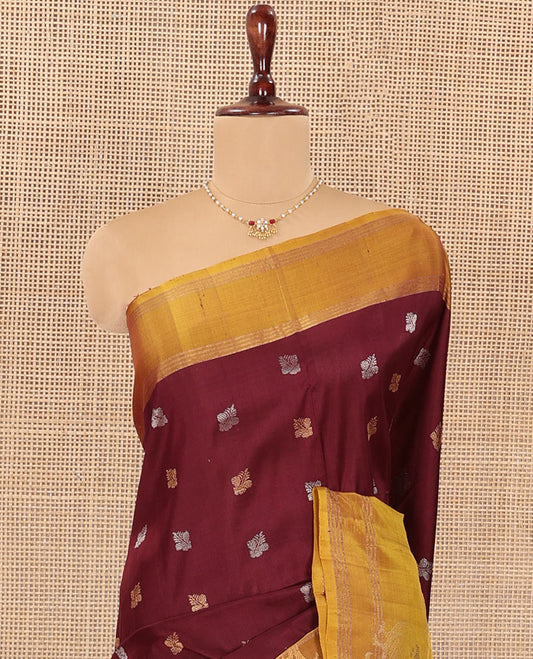 Maroon Uppada Silk Saree Ornamented with Zari Buttas, Complemented by a Contrast Zari Border of Bird Designs, Contrast Pallu of Scallop Designs, and Paired with a Contrast Blouse