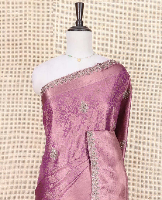 Purple Vastrakala Silk Saree, Spotlighted with Floral Jacquard and Patch Work, Highlighted by Traditional Zari Stone Embroidered Scallop Border, Grand Jaal Design Stone Work Pallu, and Paired with Heavy Embroidered Blouse
