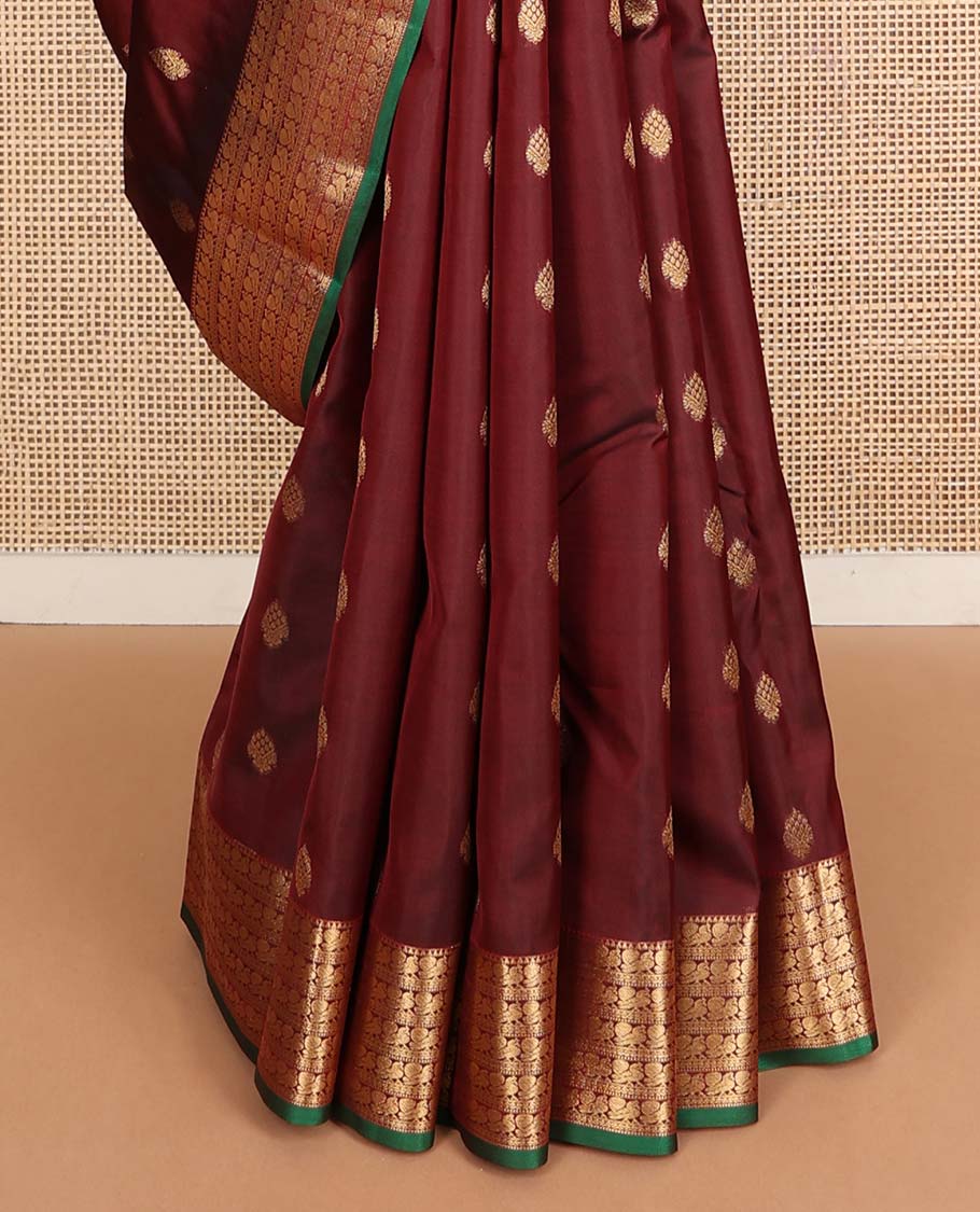 Maroon zari buttas Vasundhara silk mix saree, zari border of rekku & mayil designs & pallu steeped with mayil chakram designs