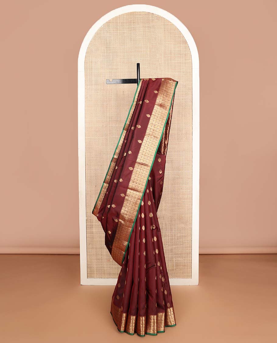 Maroon zari buttas Vasundhara silk mix saree, zari border of rekku & mayil designs & pallu steeped with mayil chakram designs