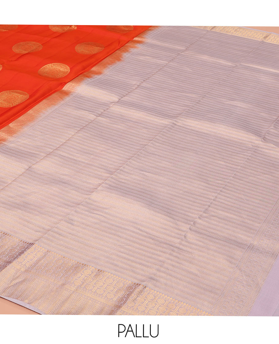 Orange Vasundhara Lite-Silk Mix Saree, Embellished with Chakram Zari Buttas All Over Its Body, Complemented by a Contrast Border of Rekku, Rudraksham, Neli, and Kathir Designs, Artfully Decked Up Pallu of Kathir Designs, and Paired with a Contrast Blouse