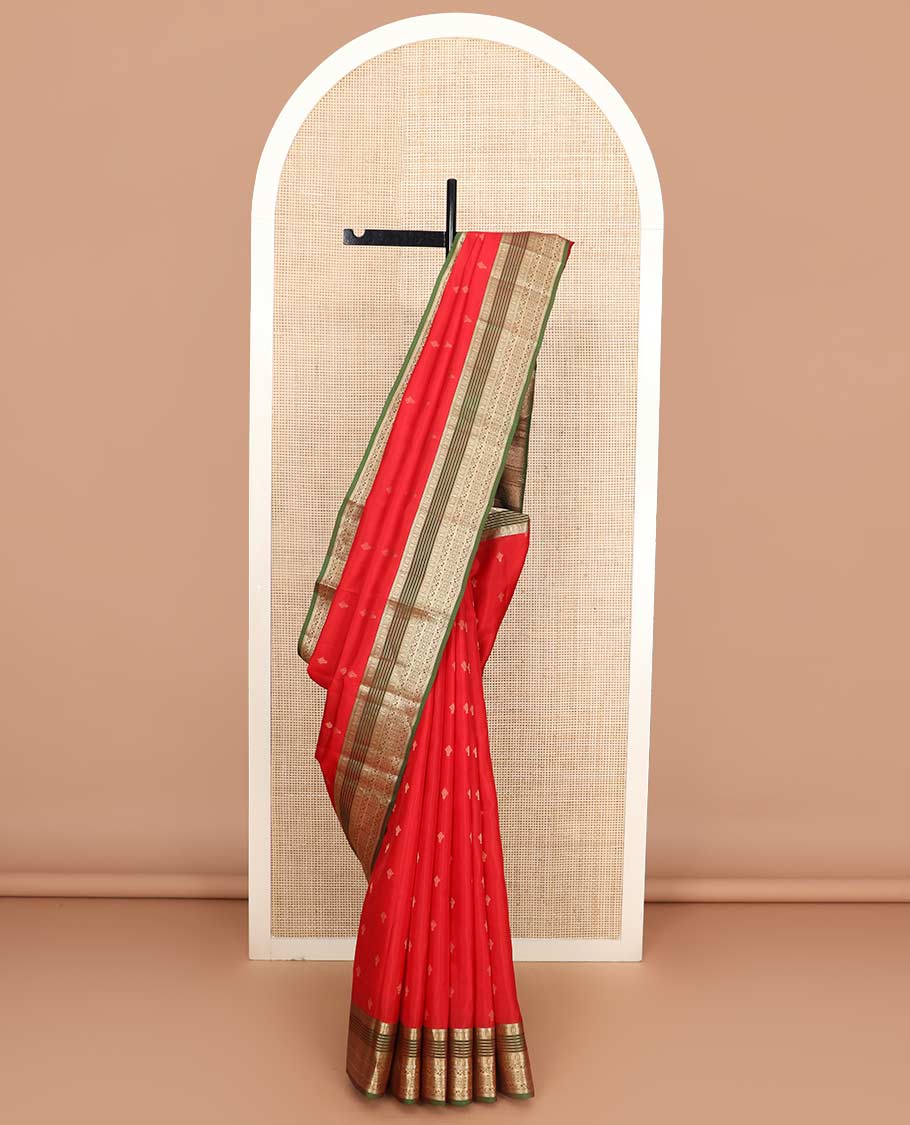 Red zari buttas Vasundhara silk mix saree, contrast border of muthu, banaras, kodi visiry, and chakram designs, and pallu of manga designs