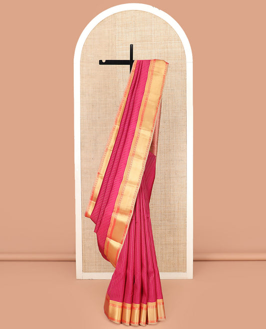 Red Vasundhara Lite Silk Mix Saree, Richly Detailed with Zari Buttas All Over Its Body, Complemented by Contrast Border of Rudraksham, Muthu, and Mayil Kann Designs, Grandly Woven Pallu of Jaal Designs, and Paired with a Contrast Blouse