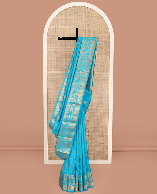 Blue Vasundhara Lite Silk Mix Saree, Artfully Detailed with Zari Buttas on Its Body, Highlighted by Zari Temple Border of Floral Designs, Gracefully Embellished Pallu of Jaal Designs, and Paired with a Matching Blouse