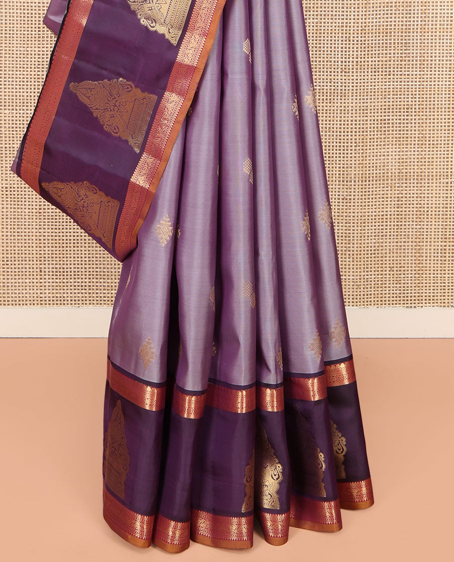 Lavender Vasundhara Lite Silk Mix Saree, Spotlighted with Zari Buttas on Its Body, Complemented by a Contrast Border of Thilakam Mokku, Mayil, and Yaali Designs, a Grandly Zari Decked Up Pallu, and Paired with a Contrast Blouse