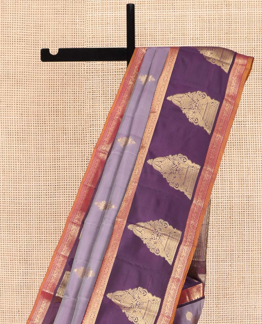 Lavender Vasundhara Lite Silk Mix Saree, Spotlighted with Zari Buttas on Its Body, Complemented by a Contrast Border of Thilakam Mokku, Mayil, and Yaali Designs, a Grandly Zari Decked Up Pallu, and Paired with a Contrast Blouse