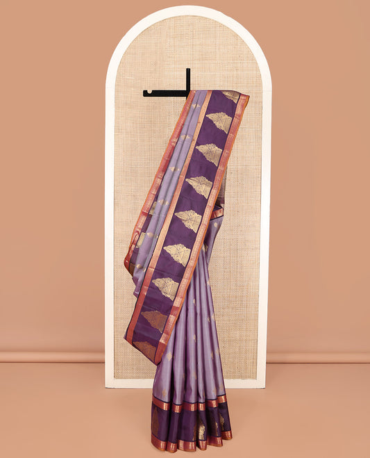 Lavender Vasundhara Lite Silk Mix Saree, Spotlighted with Zari Buttas on Its Body, Complemented by a Contrast Border of Thilakam Mokku, Mayil, and Yaali Designs, a Grandly Zari Decked Up Pallu, and Paired with a Contrast Blouse