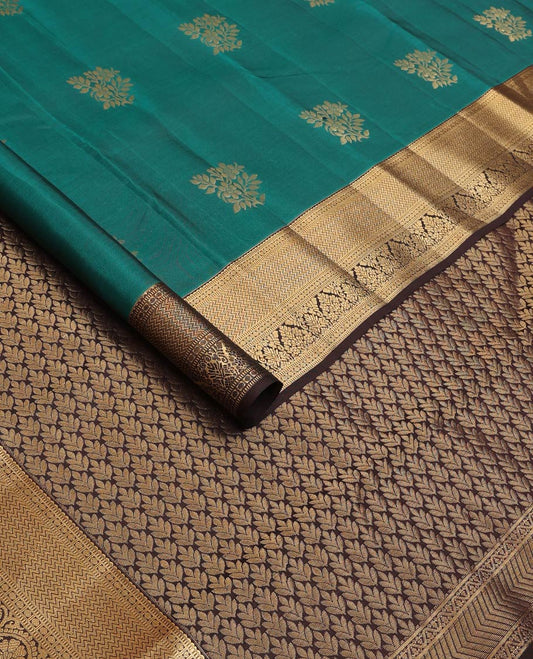 Green zari buttas Vasundhara silk mix saree, contrast border of rekku, muthu, poun, vanki, and zari designs, and leaf vine design pallu