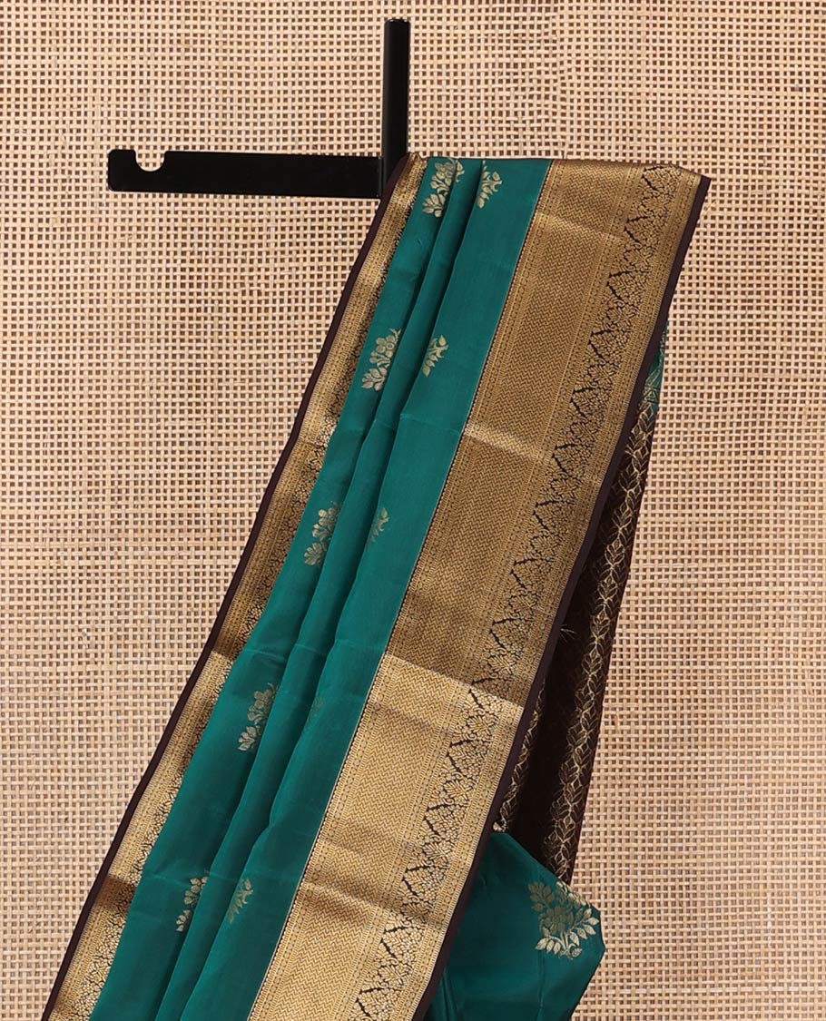 Green zari buttas Vasundhara silk mix saree, contrast border of rekku, muthu, poun, vanki, and zari designs, and leaf vine design pallu
