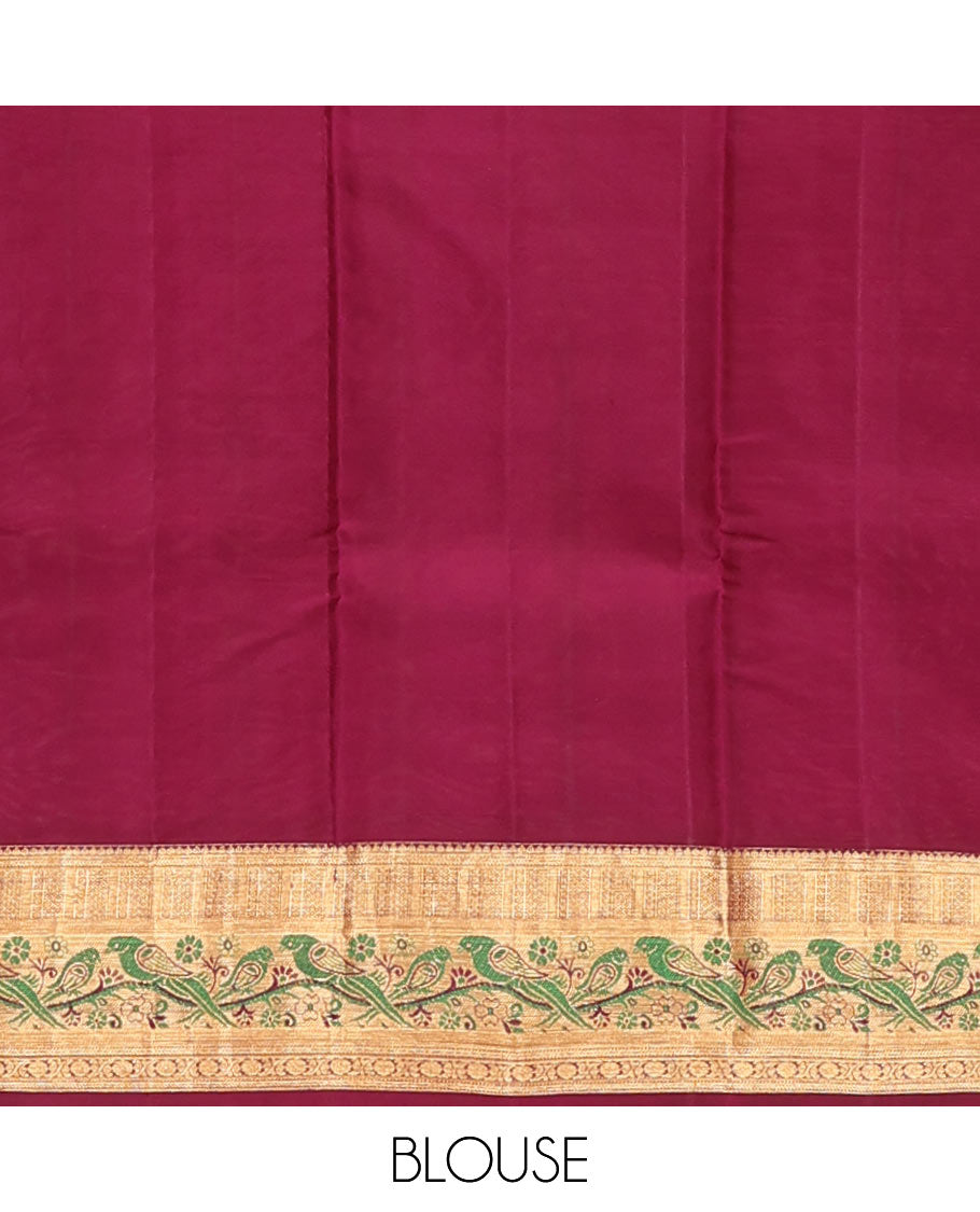 Orange Vasundhara Silk Mix Saree Decorated with Zari Buttas, Features Contrast Border Complemented with Thilakam, Banaras, Kathir, Mayil Kann, and Meenakari Parrot Motifs, a Pallu with Intricate Kanchi Motifs, Paired with a Contrast Blouse