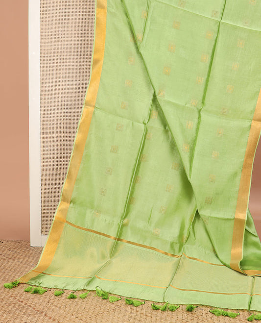 Leaf green buttas banana pith saree, zari border, and zari striped pallu