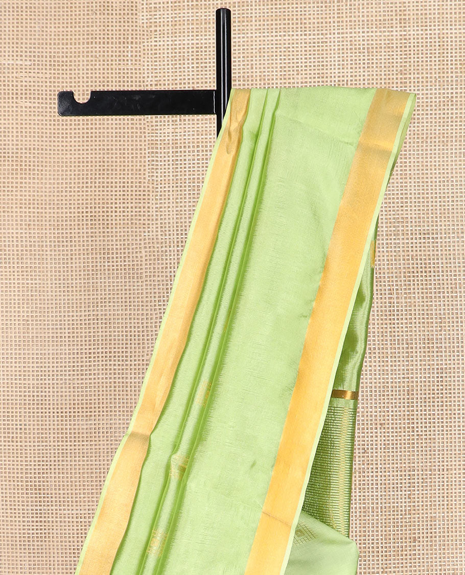 Leaf green buttas banana pith saree, zari border, and zari striped pallu
