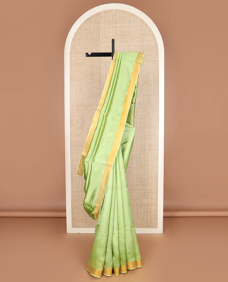 Leaf green buttas banana pith saree, zari border, and zari striped pallu
