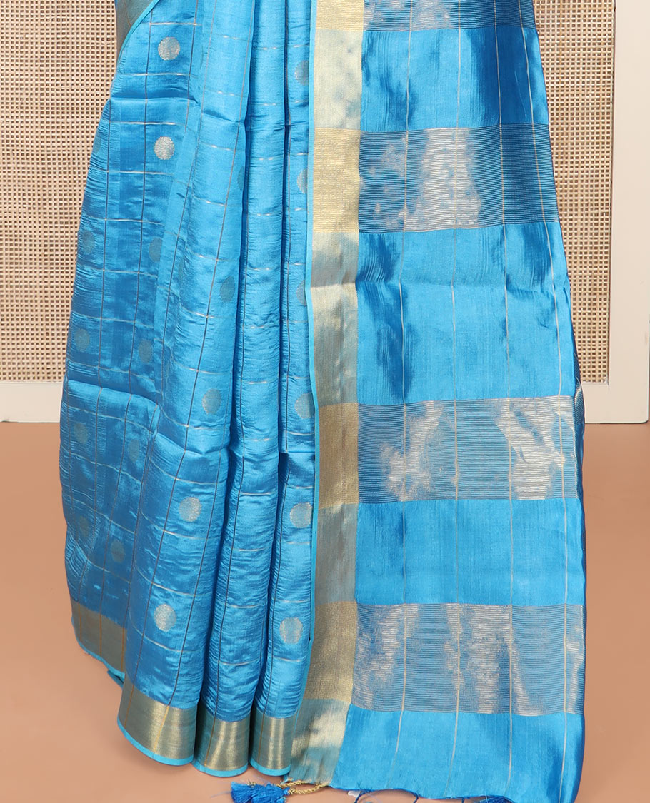 Blue Banana Pith Saree Detailed with Polka Dot Buttas Enclosed Checks, Subtle Zari Border, Gleaming Zari Stripes Woven Pallu, and Paired with a Matching Plain Blouse