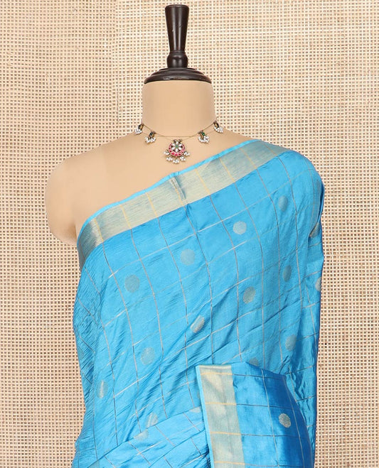 Blue Banana Pith Saree Detailed with Polka Dot Buttas Enclosed Checks, Subtle Zari Border, Gleaming Zari Stripes Woven Pallu, and Paired with a Matching Plain Blouse