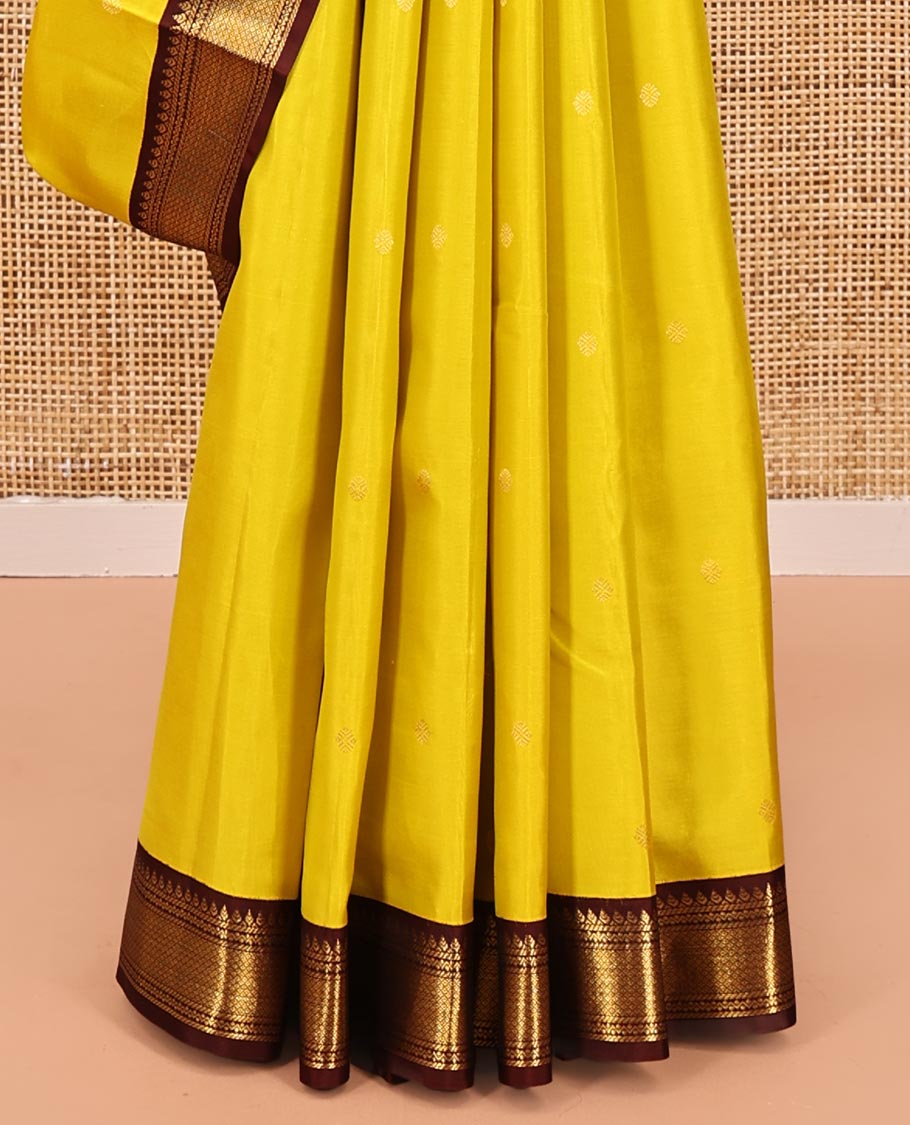 Yellow Vasundhara Silk Saree, Woven with Zari Buttas All Over Its Body, Complemented by a Contrast Korvai Border of Thilakam, Banaras, Neli, and Mayil Kann Designs, Grand Pallu, and Paired with a Contrast Blouse