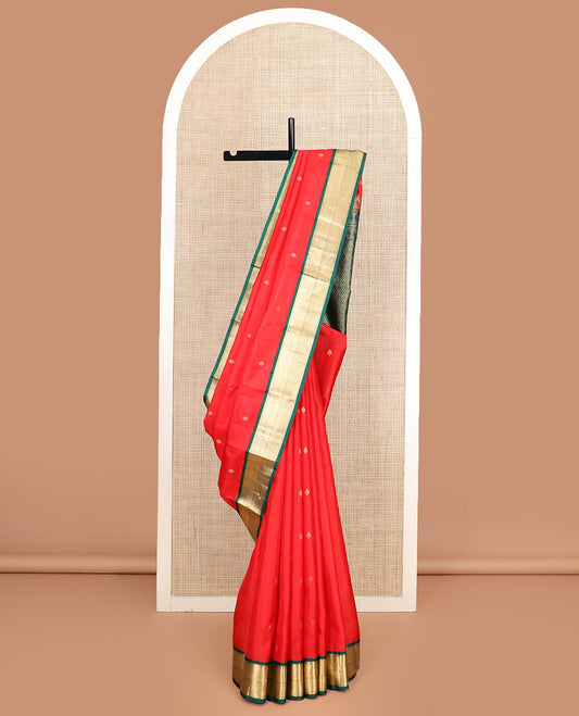 Red zari buttas silk saree, contrast border of thilakam mokku, kathir, and mayil kann, and jaal pallu