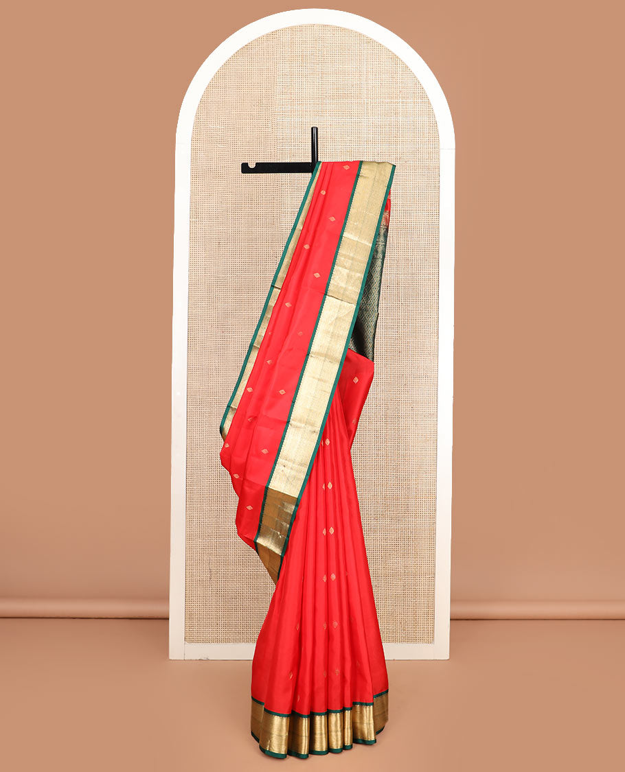 Red zari buttas silk saree, contrast border of thilakam mokku, kathir, and mayil kann, and jaal pallu