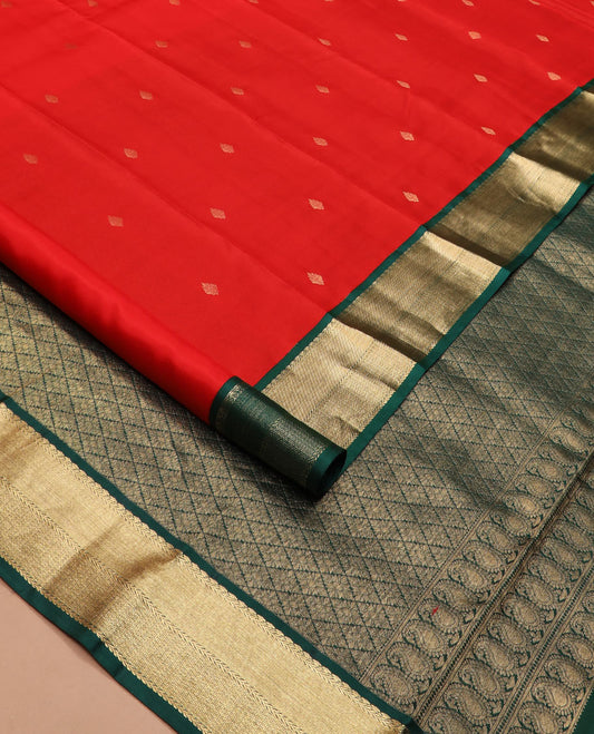 Red zari buttas silk saree, contrast border of thilakam mokku, kathir, and mayil kann, and jaal pallu