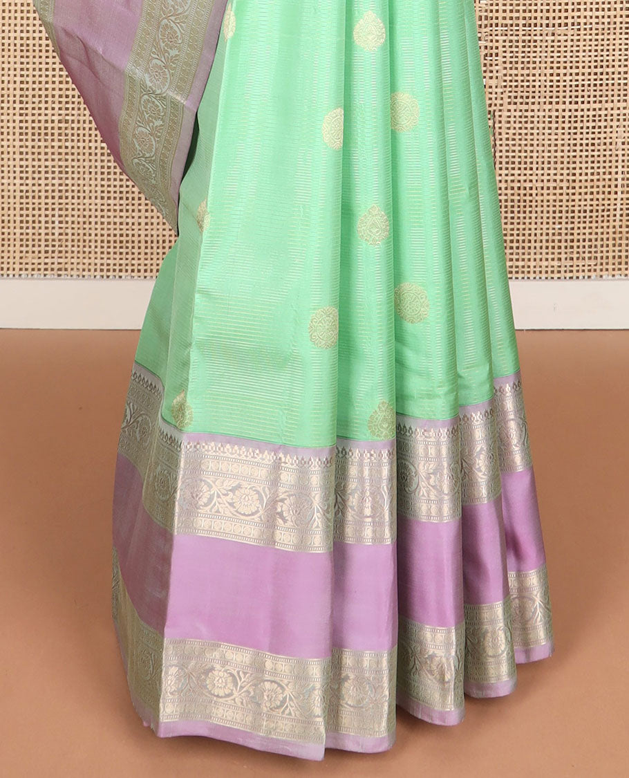 Light green striped , buttas silk saree with contrast rettai pettu border of thilakam mokku, paun, muthu design & zari design pallu
