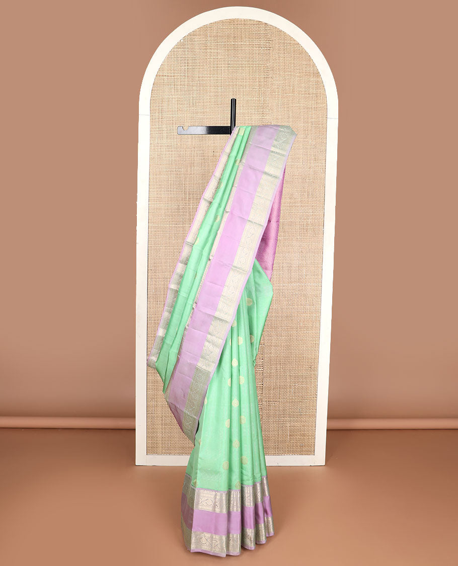 Light green striped , buttas silk saree with contrast rettai pettu border of thilakam mokku, paun, muthu design & zari design pallu