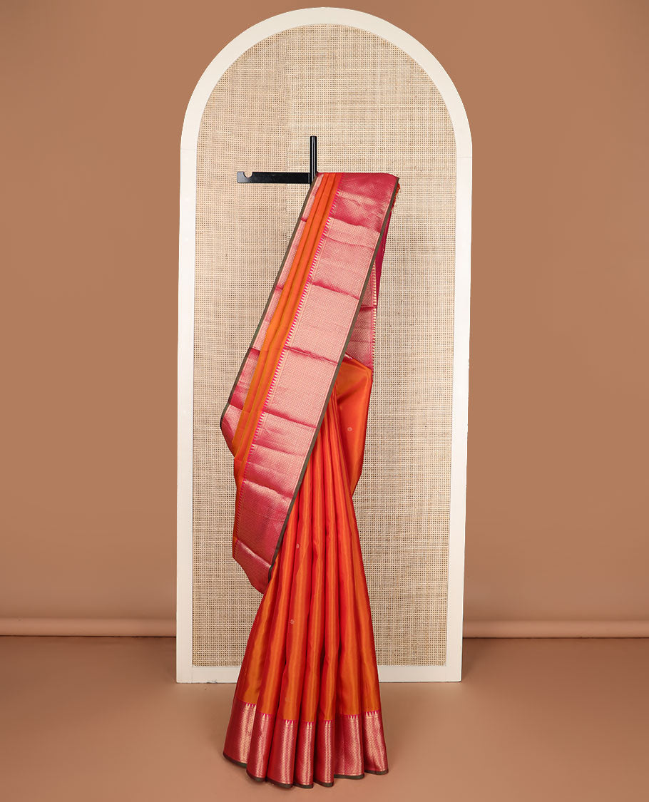 Orange zari buttas silk saree, contrast border of rekku & then kuli kann designs & pallu woven with Annam chakram & jaal design