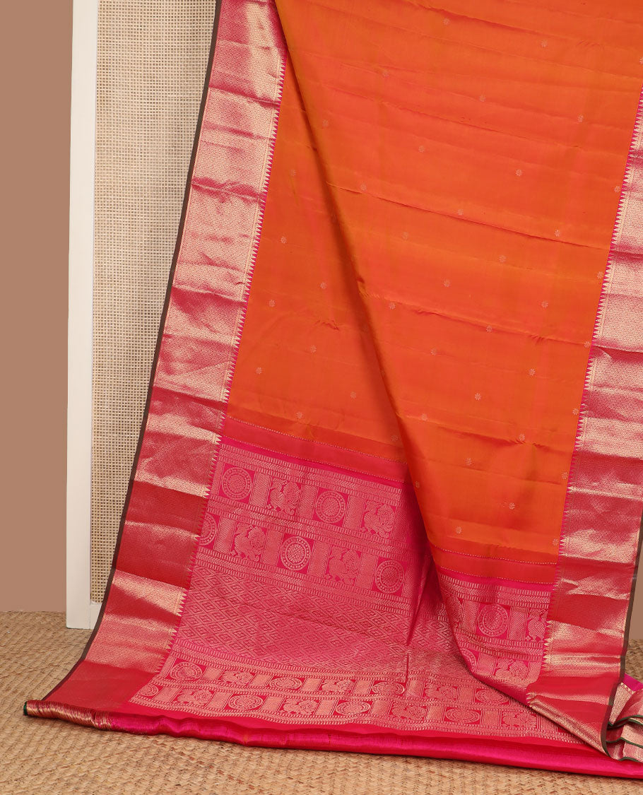 Orange zari buttas silk saree, contrast border of rekku & then kuli kann designs & pallu woven with Annam chakram & jaal design