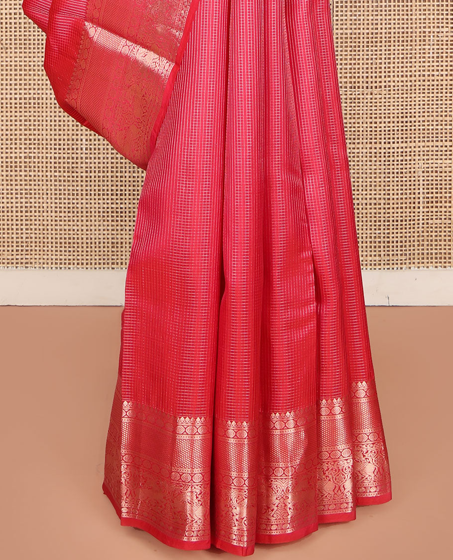 Red Vasundhara Silk Saree, Subtly Sparkled with Zari Checks All Over Its Body, Highlighted by Zari Border of Thilakam Mokku, Kamalam, Mayil Kann, Rudraksham, and Kuthirai Designs, Pallu of Jaal Designs, and Paired with a Matching Blouse